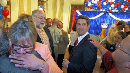 Tim Burns, center, with supporters after conceding in the 12th Congressional District last night.