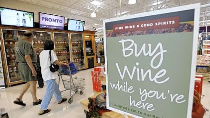 Shoppers walk past the wine selection offerings from the Pennsylvania Liquor Control Board''s self-serve wine kiosk at a Giant food store in Harrisburg, Pa.