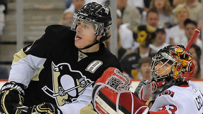 Penguins forward Evgeni Malkin works in front of Senators goaltender Pascal Leclaire during Thursday's game at Mellon Arena.