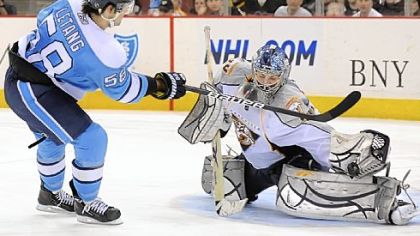 Kris Letang is stopped by Predators goalie Dan Ellis in the shootout Sunday.