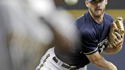 Milwaukee's Dave Bush pitches to Andrew McCutchen in the first inning Saturday night at Miller Park.