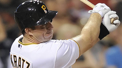 The Pirates' Erik Kratz singles in the fifth inning for his first major-league hit.