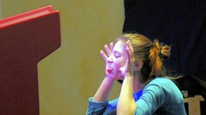 Pittsburgh-based multimedia artist, Amanda Long demonstrates her "Silly Faces" installation of the Children's Museum's  exhibit,"PITTSBURGH: Yinz Play!"