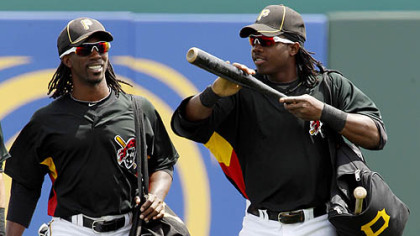 Pirates outfilenders Andrew McCutchen, left, and Lastings Milledge walk to the dugout before the game.