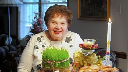 Mim Bizic with some of the Serbian Christmas items: psenica, kolach and the bread baked with a lucky coin.