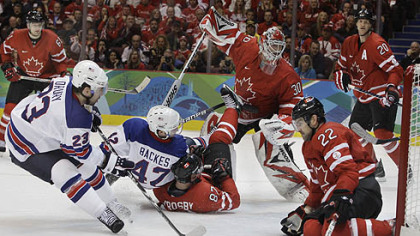 Chris Drury, left, slams home a shot into Canada's vacated net. Only defenseman Dan Boyle had a chance to stop him.