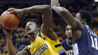 Marquette''s Jimmy Butler, left, drives to the basket against Pittsburgh''s Dante Taylor, right, in the first half of an NCAA college basketball game, Thursday, Feb. 18, 2010, in Milwaukee. (AP Photo/Darren Hauck)