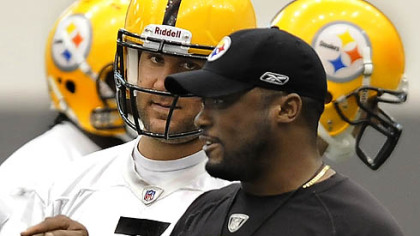 Steelers quarterback Ben Roethlisberger listens to head coach Mike Tomlin.