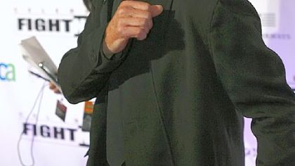 Kris Kristofferson, who will perform here June 11, strikes a boxing pose at Muhammad Ali's Celebrity Fight Night XVI last month in Phoenix.