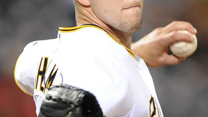 Pirates Paul Maholm delivers pitch against the Brewers.