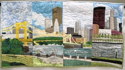"Pittsburgh," a slice quilt made by four members of the Three Rivers Quilters guild, is a 37-by-20-inch wall hanging.
