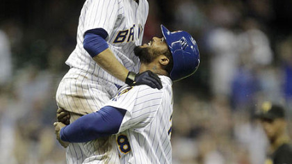 The Brewers' Prince Fielder lifts teammate Ryan Braun after Braun got a game-winning hit during the 10th inning.