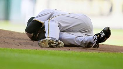 Pirates pitcher Chris Jakubauskas lays on the mound after being hit in the face with a line drive off the bat of Lance Berkman in the first inning at Minute Maid Park on Saturday in Houston.