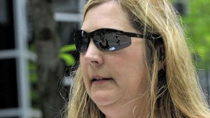 Cindy Pastin, 48, of Robinson, listens to music at different levels depending on the location and level of background noise.