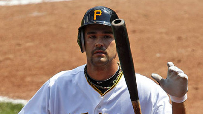 The Pirates' Garrett Jones walks back to the dugout after striking out against Cubs pitcher Sean Marshall during the ninth inning.
