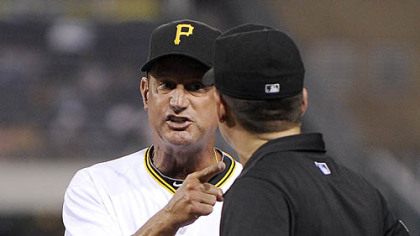 Pirates manager John Russell argues with first plate umpire D.J. Reyburn in the seventh inning.