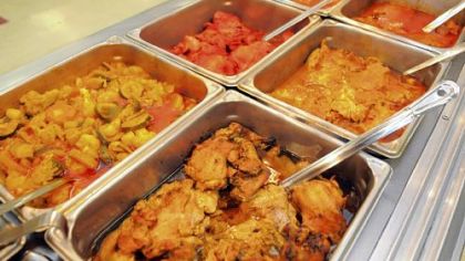 Hot prepared foods at Salem's Market & Grill in the Strip District include, from left in the back row, vegetable curry, tandoori chicken and chicken curry, and from left in front, barbecue chicken, roast chicken and lamb curry, plus rice.