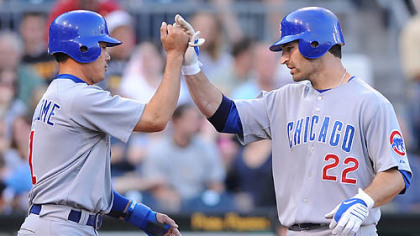 The Cubs' Xavier Nady, right, is greeted at home by Kosuke Fukudome after hitting a two-run homer off Pirates pitcher Jeff Karstens in the third inning.