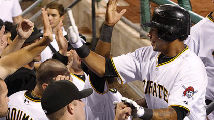 The Pirates' Jose Tabata, right, is greeted in the dugout after hitting his first major league home run off White Sox pitcher John Danks during the eighth inning.