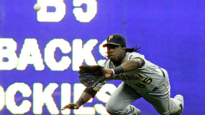 Pirates outfielder Lastings Milledge makes a diving catch on Brewers outfielder Jim Edmonds in the eigth inning.