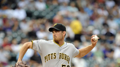 The Pirates' Zach Duke pitches in the first inning Tuesday at Coors Field.