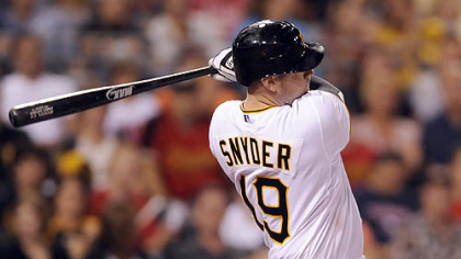 Chris Snyder hits a three-run home run against the Rockies in the sixth inning Saturday night.