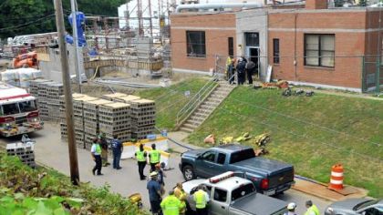 Emergency crews gather outside the Sewickley sewage treatment plant after Thursday's accident.