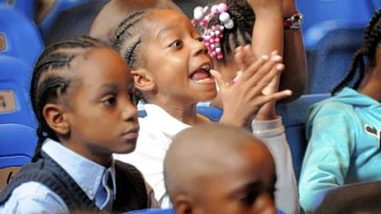 Terron Thompson, a second-grader, shows his enthusiasm for the dancers.