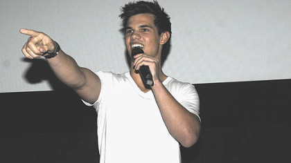 Actor Taylor Lautner addresses fans at AMC-Loews theater at The Waterfront Saturday night.