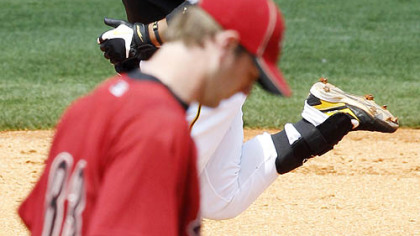 Pirates second baseman Aki Iwamura rounds the bases behind Astros pitcher Andy Van Hekken after hitting three-run homer in the third inning.