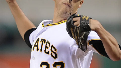 Pirates starting pitcher Jeff Karstens delivers to the Brewers Corey Hart.