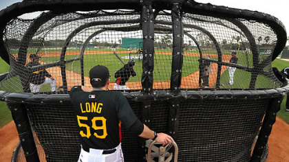 Pirates hitting coach Don Long watches Bobby Crosby take batting practice at a morning workout at Pirate City in Bradenton, Fla. The utility infielder was mentioned by manager John Russell as a right-handed hitting possibility at first base.