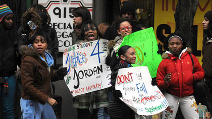 Some of the CAPA students wave their signs at motorists along Liberty Avenue as they marched to the mayor's office and City Council chambers.