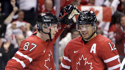 Sidney Crosby congratulates Canada linemate Jarome Iginla on the second of his three goals Tuesday.