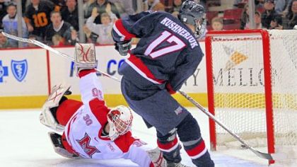 Robert Morris' Chris Kushneriuk gets the first score of the game, a short-handed goal with less that 30 seconds left in the first period, against Miami goaltender Cody Reichard.