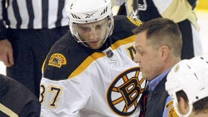 Marc Savard is carried off the Mellon Arena ice last Sunday after being hit by Matt Cooke.