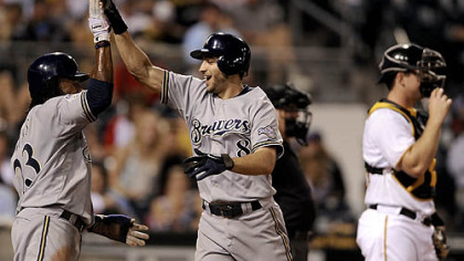 The Brewers' Ryan Braun, right, is congratulated by teammate Rickie Weeks after hitting a two-run home run in the sixth inning.