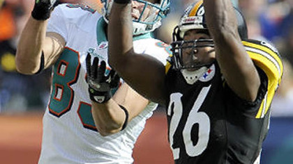 Steelers cornerback Deshea Townsend intercepts a pass in front of Dolphins wide receiver Greg Camarillo during a game at Landshark Stadium in Miami earlier this month.