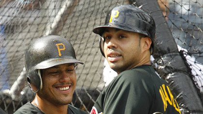 The Pirates' Pedro Alvarez, right, and teammate Delwyn Young wait their turn in the batting batting cage.