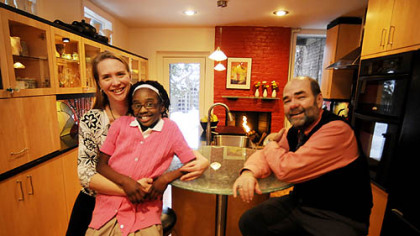 Darlene and Derwin Rushing, with daughter Laila, 7,  in their renovated Mexican War Streets kitchen. The project, completed in 2007, won first-place in the PG's 2009-10 Renovation Inspiration contest.