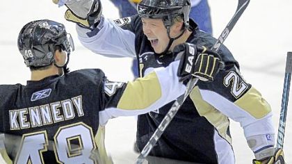 Ruslan Fedotenko celebrates his third period goal with Tyler Kennedy Tuesday night in the Penguins' first game back from the Olympic break -- a 3-2 victory against Buffalo at Mellon Arena.