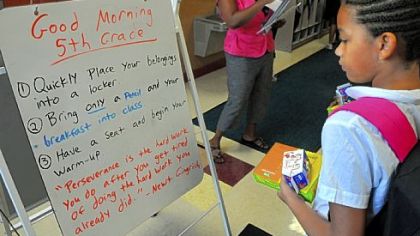 Fifth-grader Patricia Brown, 10, checks the morning message board for directions at Propel McKeesport.