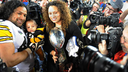 Troy and Theodora Polamalu with son Paisios after the 2009 Super Bowl.