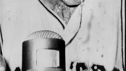 Champagne drops off the head of Bill Mazeroski in the dressing room.