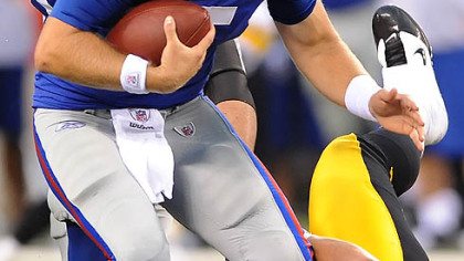 Defensive end Aaron Smith sacks Giants quarterback Rhett Bomar Saturday at New Meadowlands Stadium in East Rutherford, N.J.