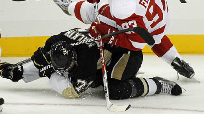Red Wings forward Johan Franzen collides with Penguins forward Evgeni Malkin during the first period.