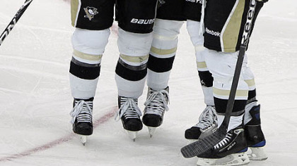 Penguins forward Mark Letestu, right, is congratulated by teammates Chris Kunitz, left, and Michael Rupp after Letestu's goal during the second period.