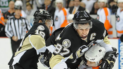 Penguins captain Sidney Crosby is upended by Flyers defenseman Kimmo Timonen in the third period.