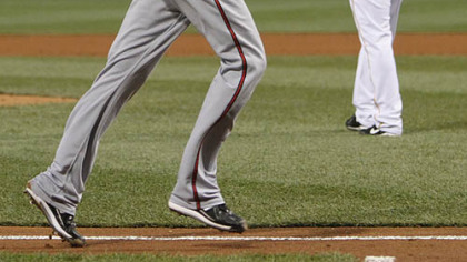 Braves pitcher Derek Lowe trots home from third base after Pirates pitcher Daniel McCutchen walked Derrek Lee with the bases loaded in the second inning.