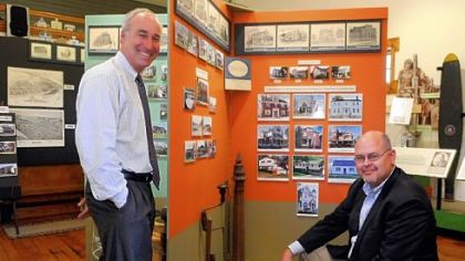 Edwards McLaughlin, left, and Mark Miner of the Beaver Area Heritage Museum take a look at "Bricks, Mortar and Charm," an exhibition that documents the architecture of Beaver.